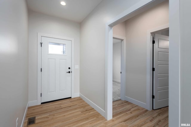 foyer with light hardwood / wood-style floors