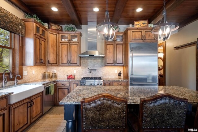 kitchen featuring a kitchen island, stainless steel appliances, beamed ceiling, wall chimney exhaust hood, and wood ceiling