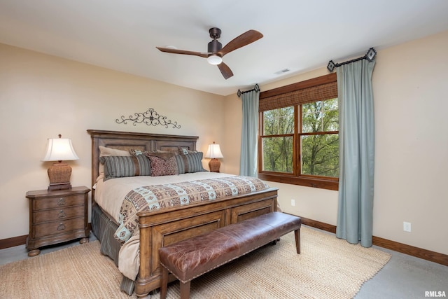 bedroom featuring ceiling fan and concrete flooring