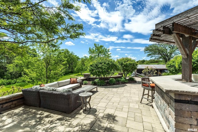 view of patio with a pergola and an outdoor hangout area