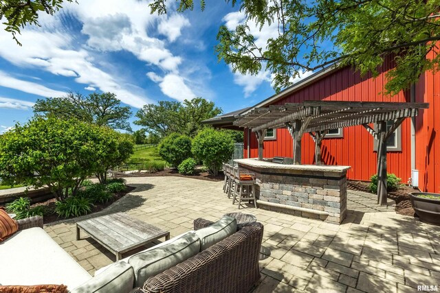 view of patio with a pergola, outdoor lounge area, and exterior bar