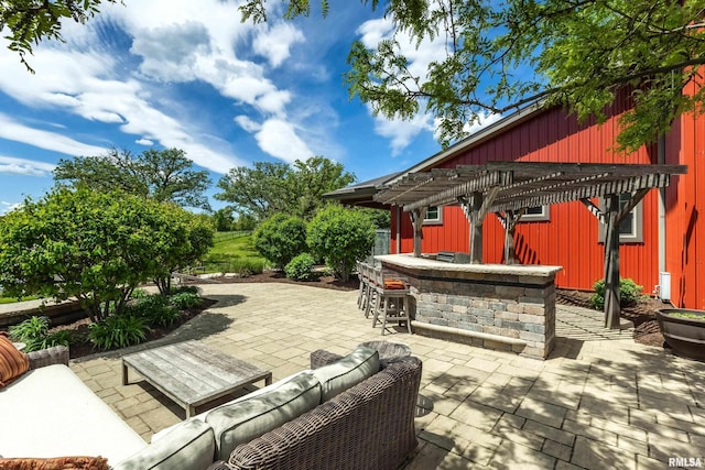 view of patio / terrace featuring a pergola, outdoor dry bar, and an outdoor hangout area