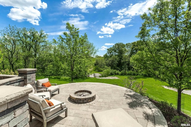 view of terrace with a fire pit