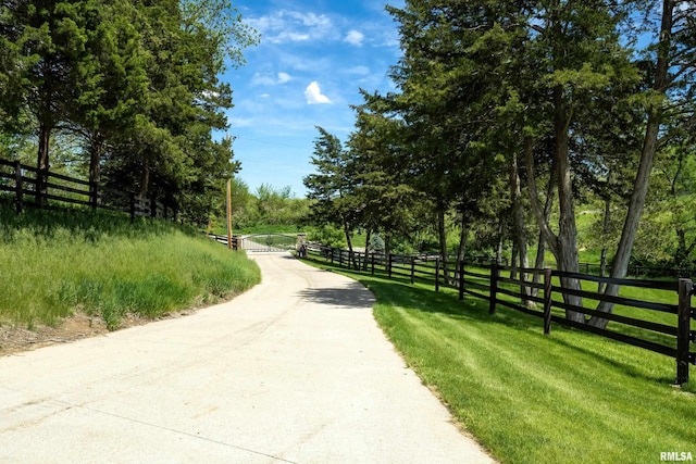 view of home's community with fence