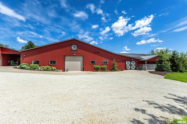 exterior space featuring an outbuilding and a garage