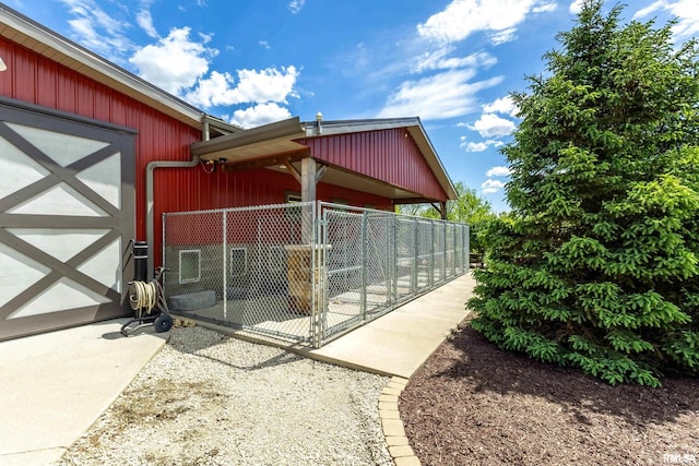 view of side of property with an outbuilding