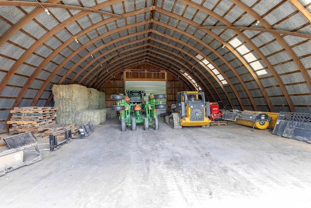 interior space with concrete flooring and lofted ceiling