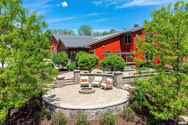 view of patio featuring an outdoor fire pit