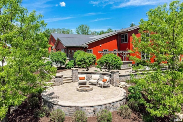 view of patio with a fire pit