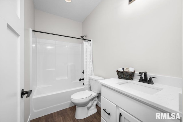 full bathroom featuring shower / bathing tub combination, vanity, hardwood / wood-style flooring, and toilet