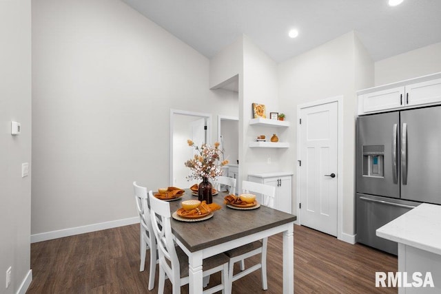 dining area featuring dark hardwood / wood-style floors