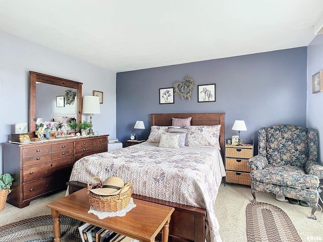 bedroom featuring light colored carpet