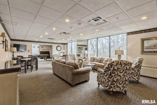 living room with carpet floors, a paneled ceiling, radiator, and billiards