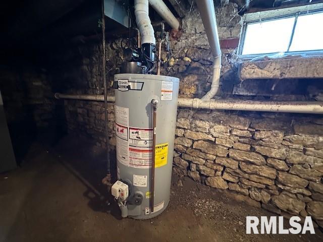 utility room featuring gas water heater