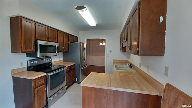 kitchen with appliances with stainless steel finishes and sink