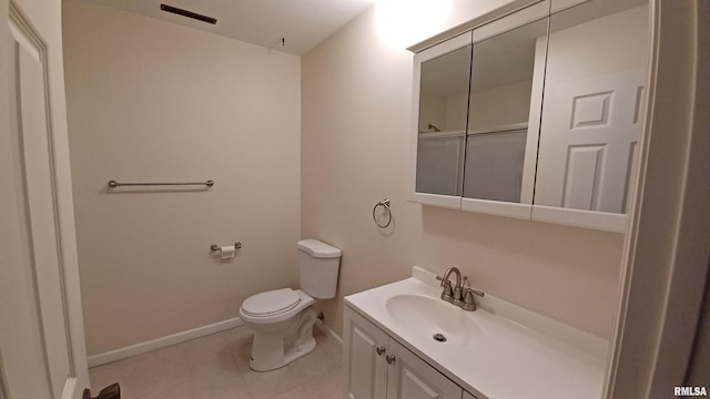 bathroom featuring tile patterned floors, a shower, vanity, and toilet