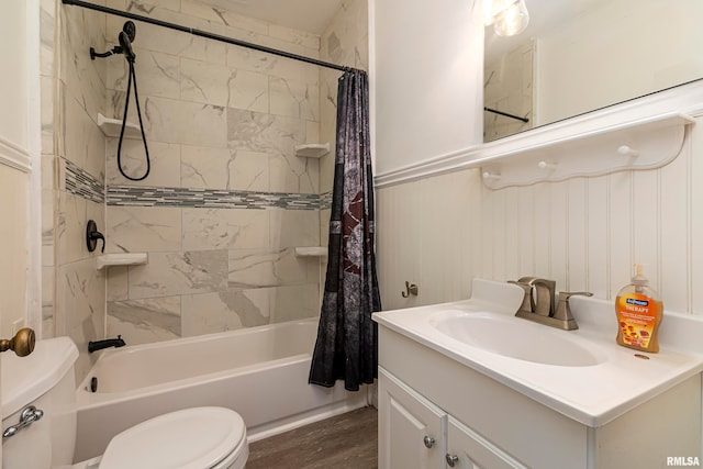 full bathroom with vanity, toilet, shower / bath combo, and hardwood / wood-style floors