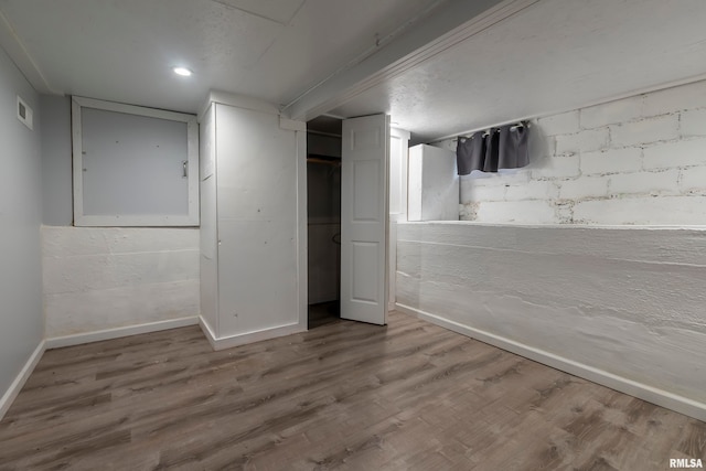 basement featuring hardwood / wood-style floors