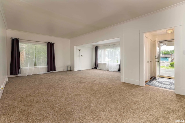 unfurnished living room with carpet flooring and ornamental molding