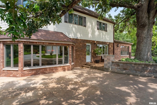 back of house with a patio