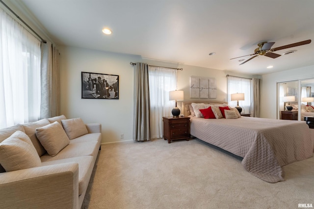 carpeted bedroom featuring ceiling fan