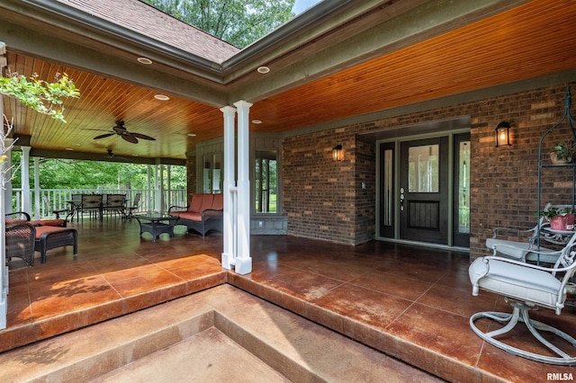 exterior space featuring ceiling fan