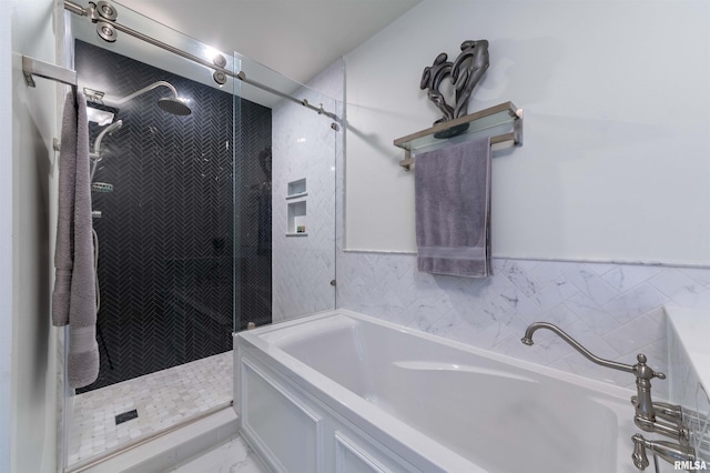 bathroom with separate shower and tub