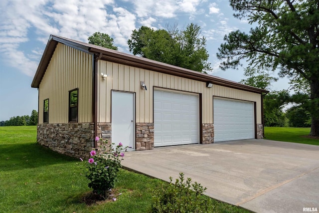 garage featuring a lawn