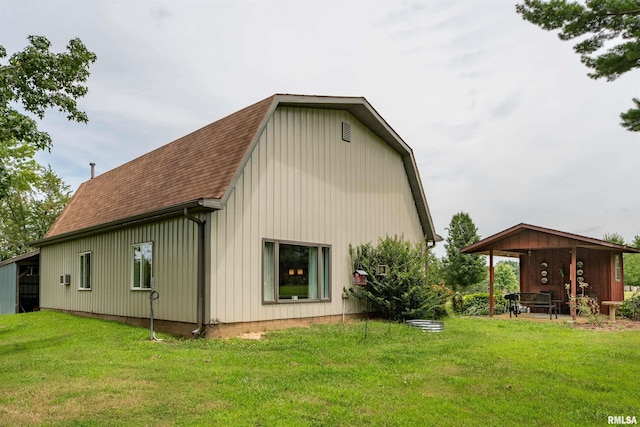 rear view of property featuring a yard