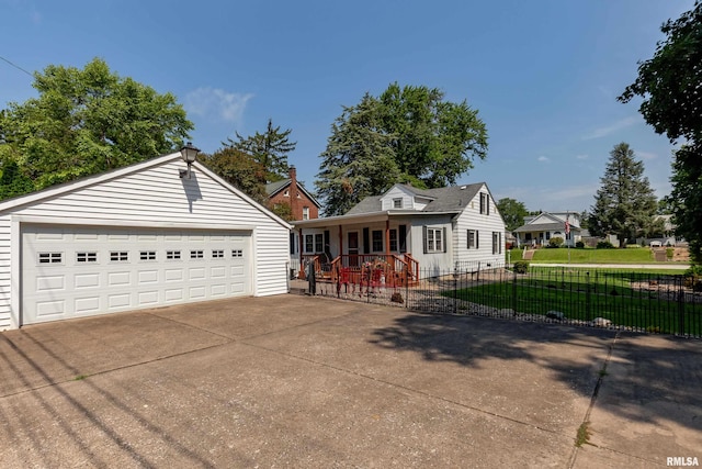 view of front of home with a porch, a garage, and a front lawn