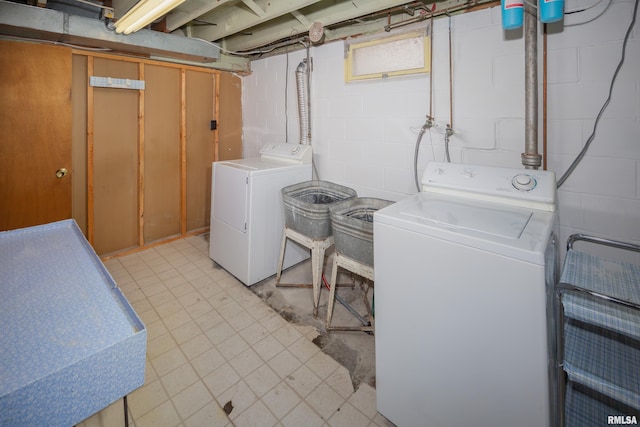 washroom featuring washing machine and dryer