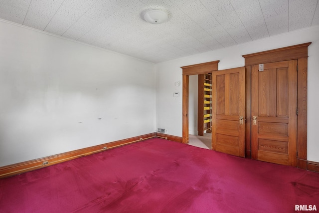 unfurnished bedroom with carpet floors