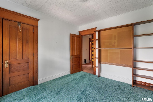 unfurnished bedroom with carpet flooring