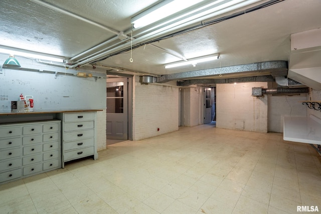 basement featuring light tile patterned flooring