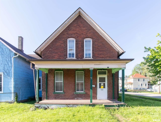 view of front facade featuring a porch and a front lawn