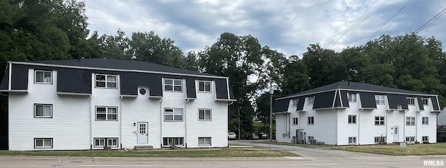 view of building exterior featuring central AC unit