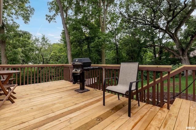 wooden deck featuring grilling area