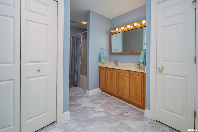 bathroom featuring vanity and shower / bath combo with shower curtain