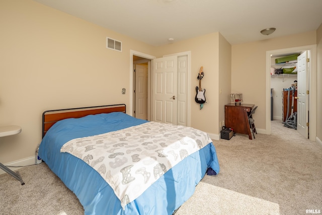 carpeted bedroom featuring a closet