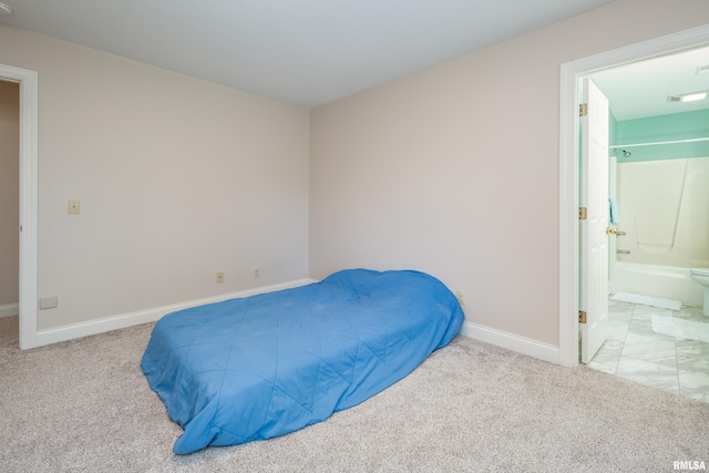 carpeted bedroom featuring connected bathroom