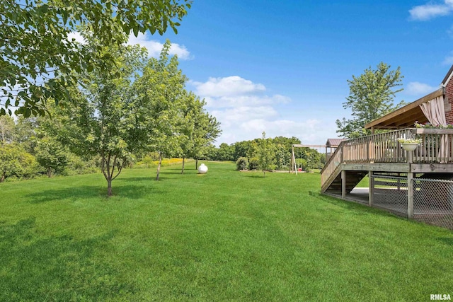 view of yard with a wooden deck