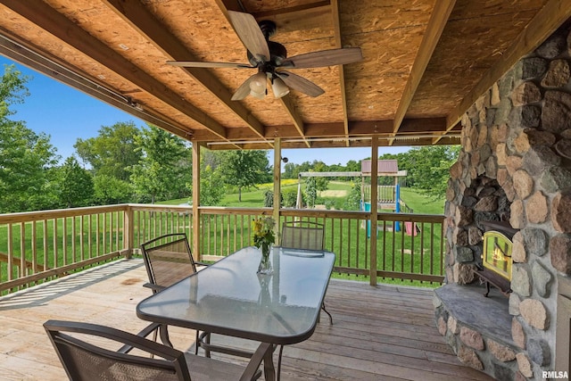 deck featuring a playground and ceiling fan