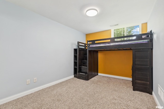 unfurnished bedroom with carpet