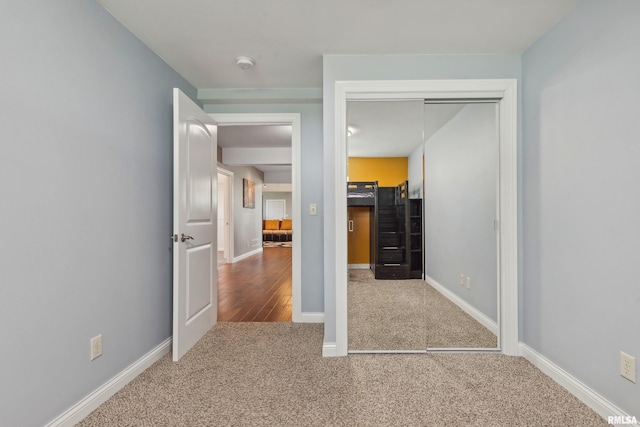 unfurnished bedroom featuring carpet floors and a closet