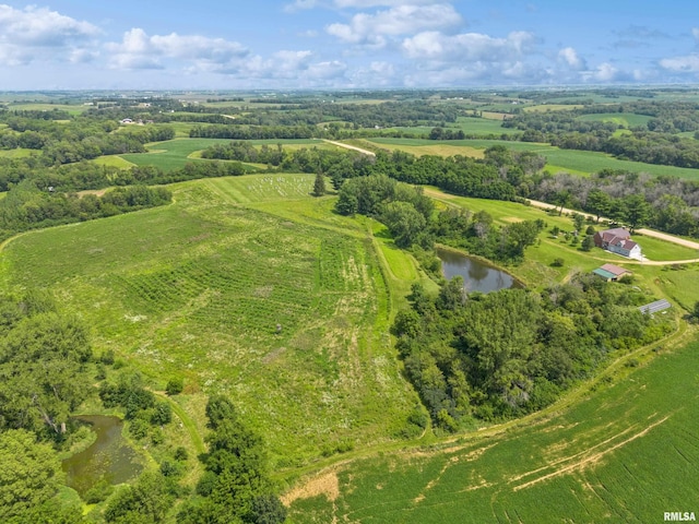 aerial view with a rural view and a water view