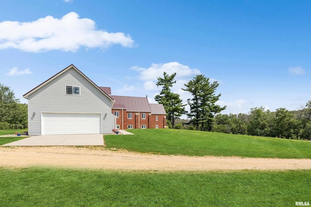 view of front of house featuring a garage and a front lawn