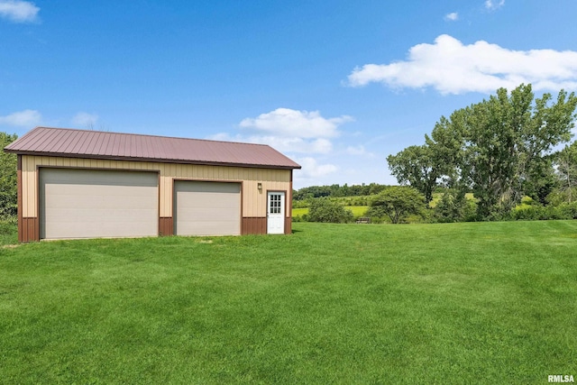 garage with a yard