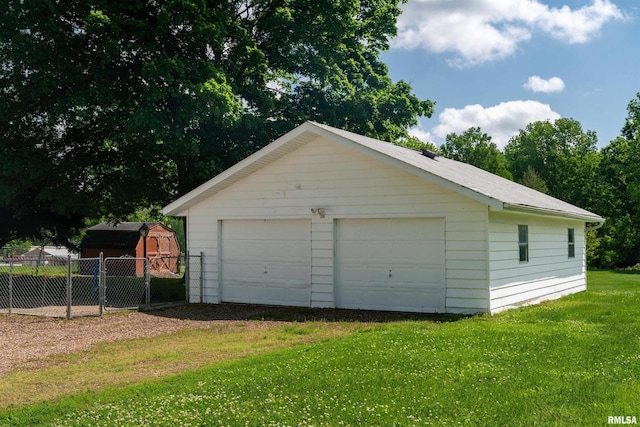 garage with a lawn