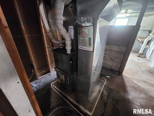 utility room featuring heating unit