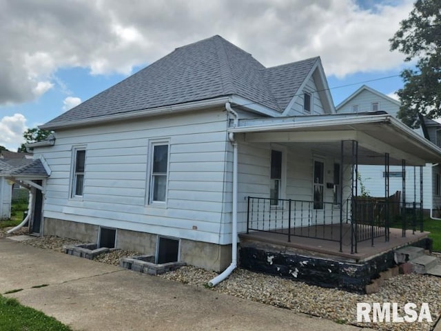 view of property exterior with a porch